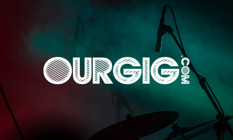 ourgig.com logo over photo if a stage